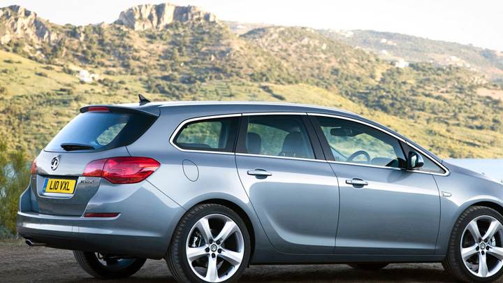 2011 Vauxhall Astra Sports Tourer In Blue Side Pose Near Mountains